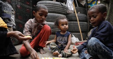 Yemeni children share food at a shelter as part of a makeshift camp for Internally Displaced Persons (IDPs) in Sana&#039;a, Yemen, Aug. 22, 2023. (EPA Photo)
