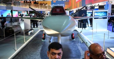 Visitors stand by an intelligent aircraft by Bae Systems during the Defence and Security Equipment International (DSEI) fair at the ExCeL center, London, U.K., Sept. 12, 2023. (AFP Photo)