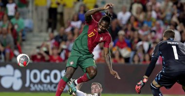 Portugal's Rafael Leao (L) fights for the ball with Luxembourg`s Laurent Jans in a UEFA Euro 2024 qualifying match in Faro, Portugal, Sept. 11, 2023. (EPA Photo)