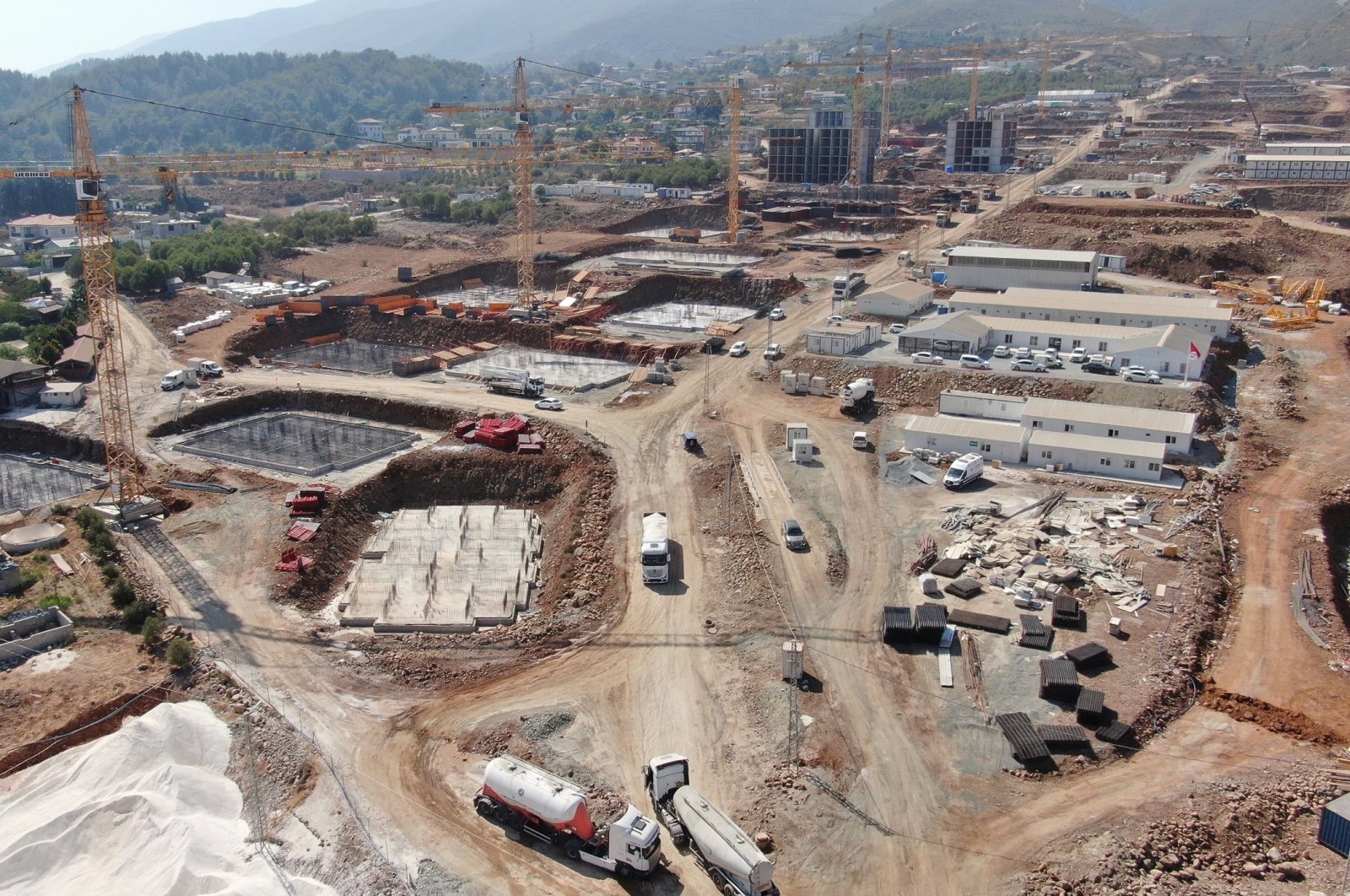 Aerial view of ongoing construction of new housing units in the earthquake-hit province of Hatay, southeastern Türkiye, Aug. 23, 2023. (IHA Photo)
