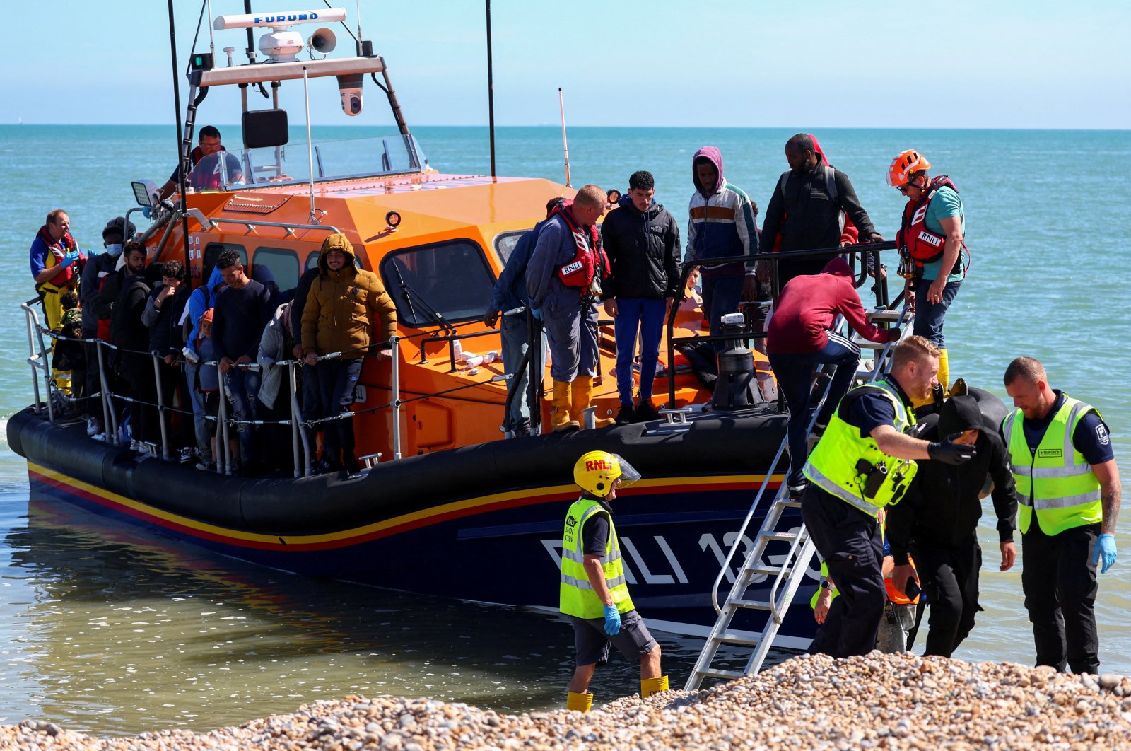 People, believed to be migrants, arrive on a lifeboat in Dungeness, Britain, Aug. 16, 2023. (Reuters File Photo)