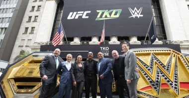 (L-R) WWE Chief Content Officer Paul Levesque (Triple H), TKO   Endeavor CEO Ariel Emanuel, WWE Superstars Bianca Belair and Montez Ford, UFC hall of famer Daniel Cormier, UFC CEO Dana White, and TKO   Endeavor President and COO Mark Shapiro pose outside the New York Stock Exchange during the TKO Group Holdings' listing, New York, US., Sept. 12, 2023. (Getty Images Photo)
