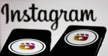 Instagram Reels logos displayed on smartphone screens in front of an Instagram logo in this illustration photo taken in Krakow, Poland, Nov. 2, 2021. (Getty Images Illustration)