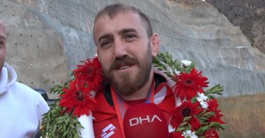 Mehmet Tüylü speaks to the press after returning from the 7th Deaf Wrestling World Championship, Artvin, Türkiye, Sept. 12, 2023. (DHA Photo)
