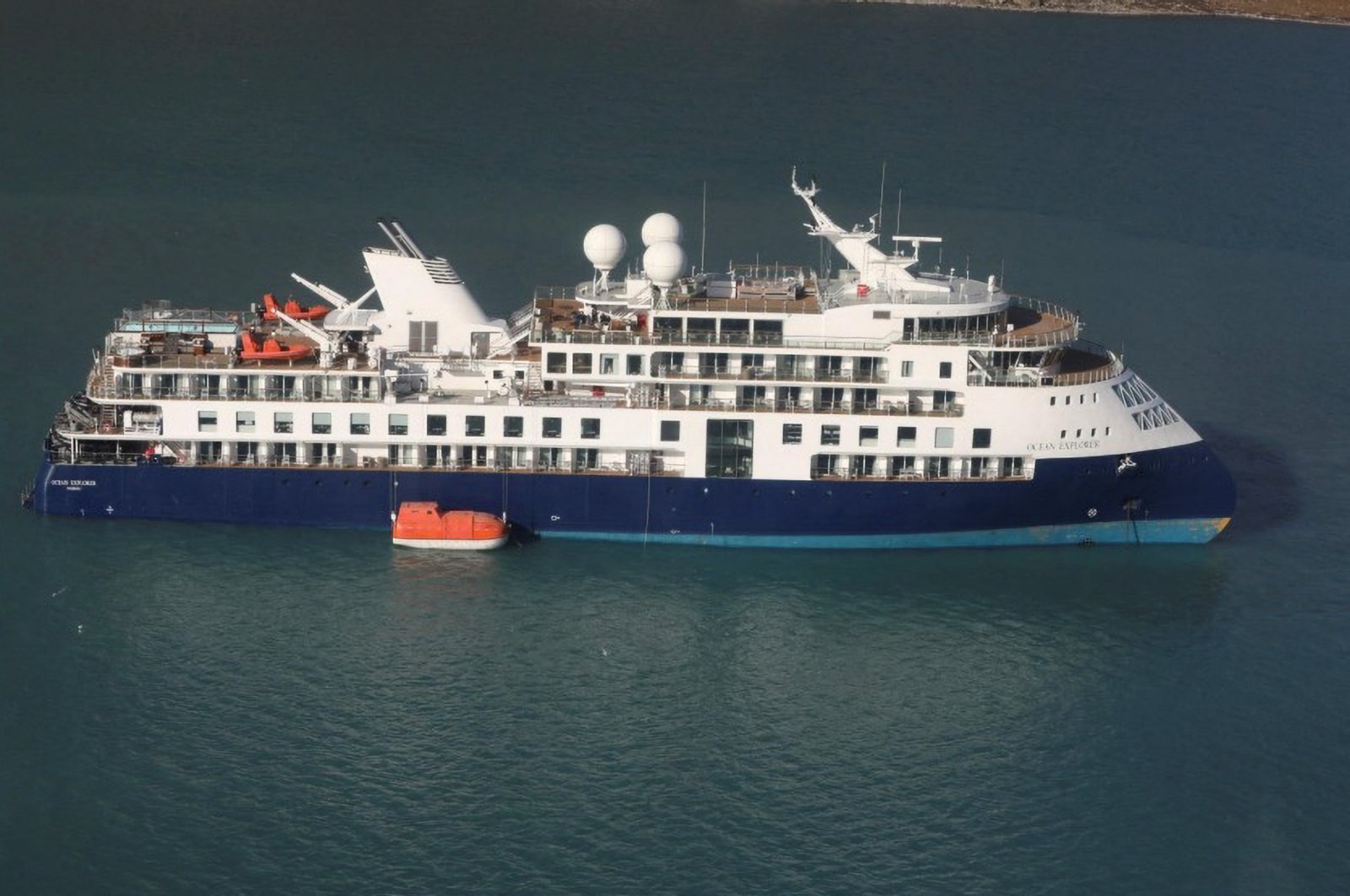 View of the Ocean Explorer, a luxury cruise ship carrying 206 people that ran aground, in Alpefjord, Greenland, Sept. 12, 2023. (Reuters Photo)