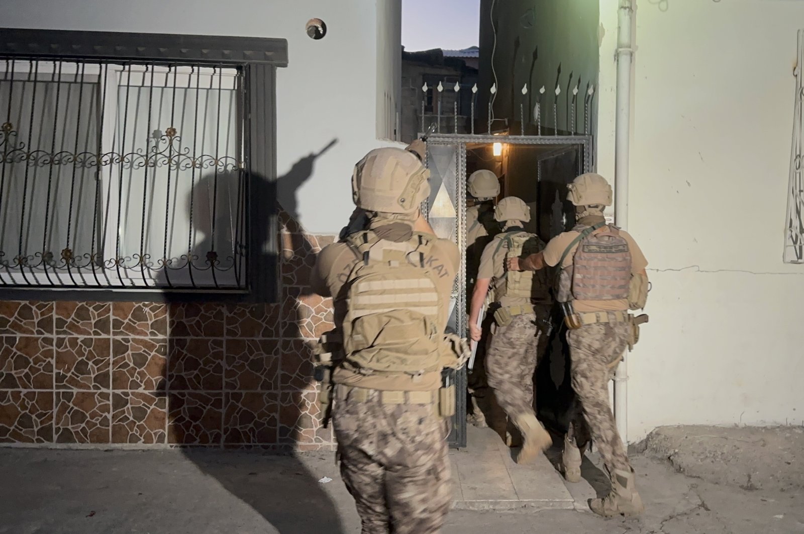 Counterterrorism police raid a location in Mersin, southern Türkiye, Sept. 13, 2023. (İHA Photo)