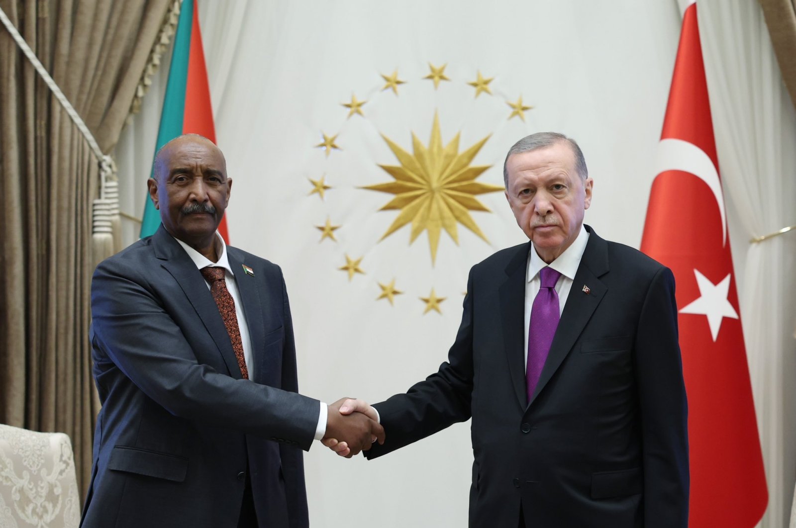 President Recep Tayyip Erdoğan and Gen. Abdel-Fattah al-Burhan shake hands at the Presidential Complex in Ankara, Sept. 13, 2023. (DHA Photo)