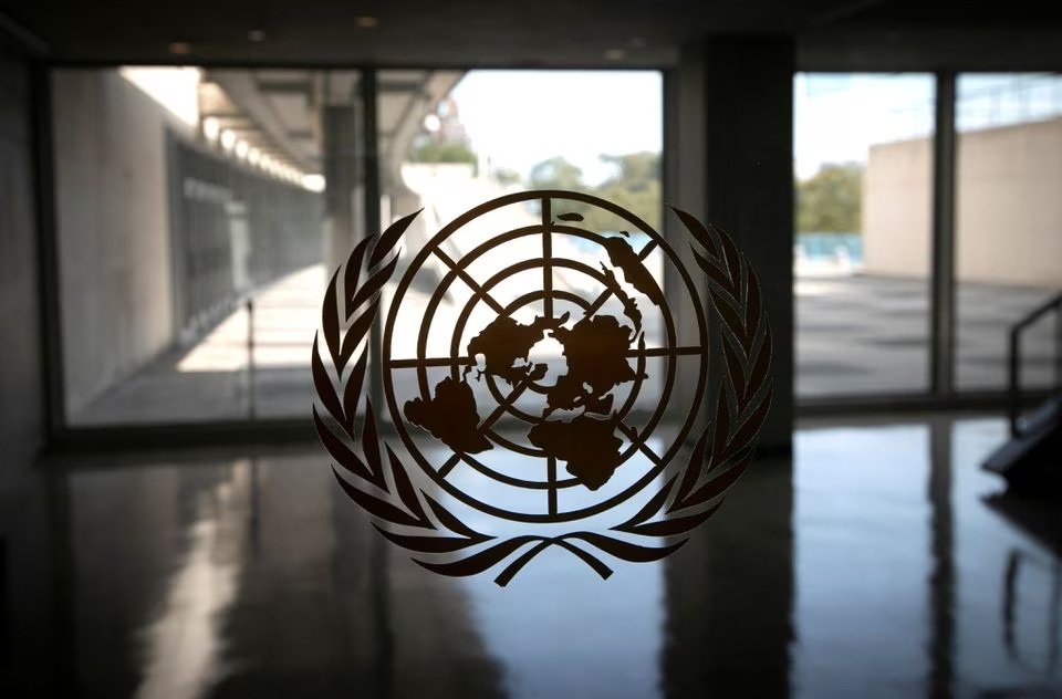 The United Nations logo is seen on a window in an empty hallway at U.N. headquarters during the 75th annual U.N. General Assembly high-level debate, Sept. 21, 2020. (Reuters Photo)