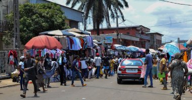 People shop in a market a day after President Ali Bongo Ondimba was ousted in a coup in Libreville, Gabon, Aug. 31, 2023. (EPA Photo)