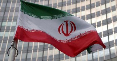 The Iranian flag flutters in front of the International Atomic Energy Agency (IAEA) organisation's headquarters in Vienna, Austria, June 5, 2023. (Reuters Photo)