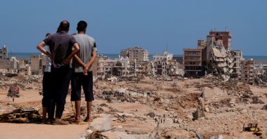 A view shows people looking at the damaged areas, in the aftermath of the floods in Derna, Libya September 14, 2023. REUTERS/Esam Omran Al-Fetori