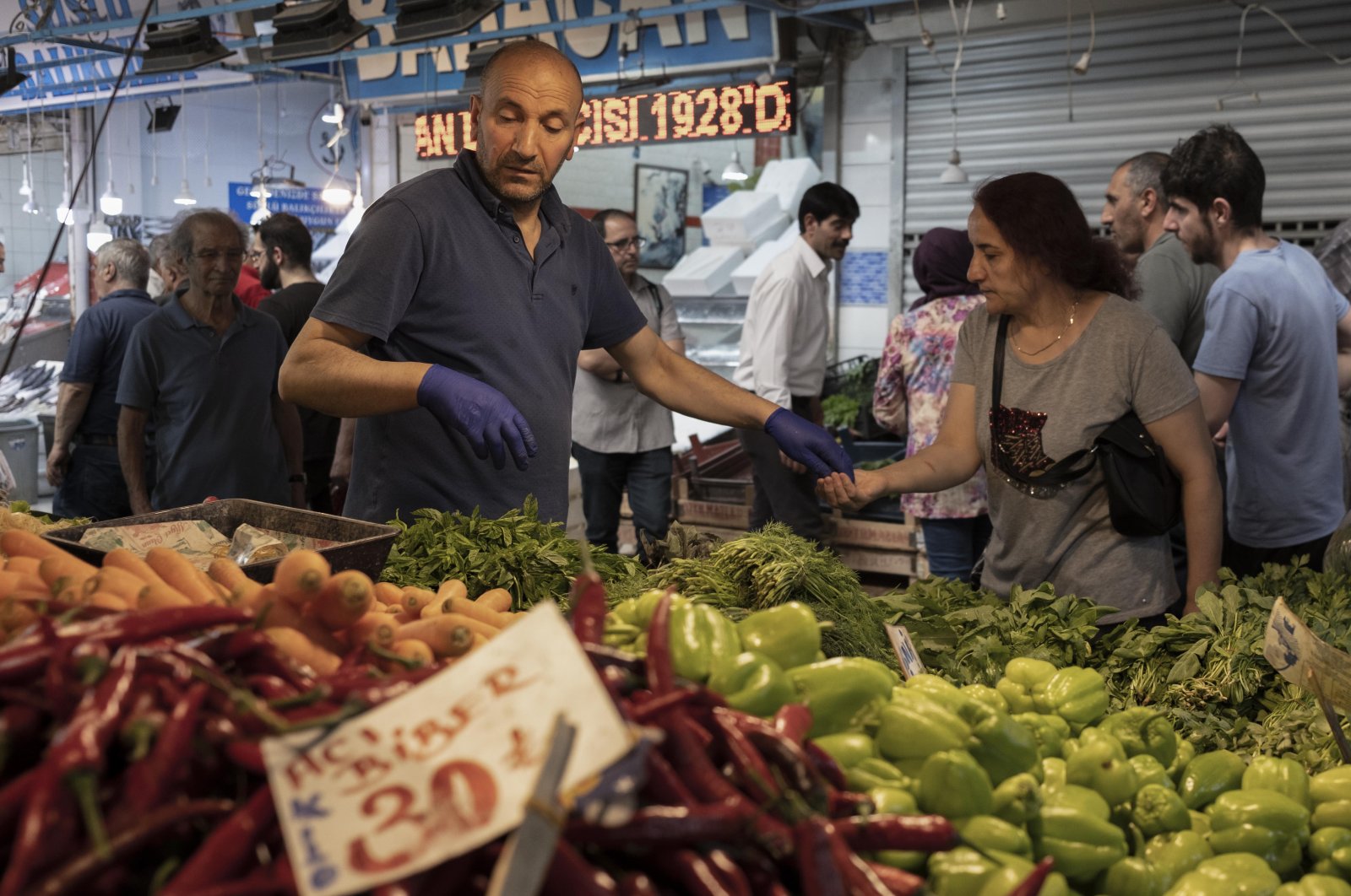 A woman shops for fruits and vegetables at the Ulus Market ahead of Qurban Bayram, or Eid al-Adha, in Ankara, Türkiye, June 26, 2023. (Reuters Photo)