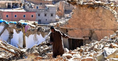A man walks past debris from destroyed buildings in the earthquake-hit village, Ardouz, Morocco, Sept. 14, 2023. (AFP Photo)