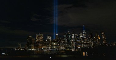 The annual Tribute in Light, which honors the memory of the Twin Towers, is glimpsed from the Brooklyn promenade as the nation commemorates the 22nd anniversary of the attacks in New York City, U.S., Sept. 11, 2023. (AFP Photo)