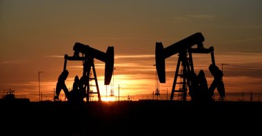 Pump jacks operate at sunset in an oil field in Midland, Texas, U.S., Aug. 22, 2018. (Reuters Photo)