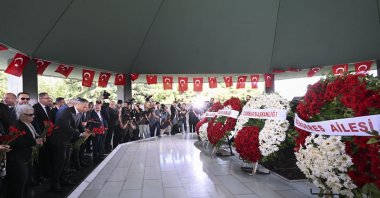 Officials and families lay flowers at the burial site of the late Prime Minister Adnan Menderes, Foreign Minister Fatin Rüştü Zorlu and Finance Minister Hasan Polatkan in Istanbul, Türkiye, Sept. 17, 2023. (AA Photo)