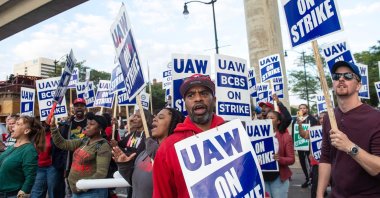 Blue Cross Blue Shield employees show their support to members of the United Auto Workers (UAW) union as they march through the streets of downtown Detroit following a rally on the first day of the UAW strike in Detroit, Michigan, U.S., Sept. 15, 2023. (AFP Photo)
