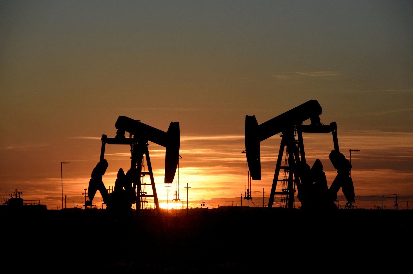 Pump jacks operate at sunset in an oil field in Midland, Texas, U.S., Aug. 22, 2018. (Reuters Photo)