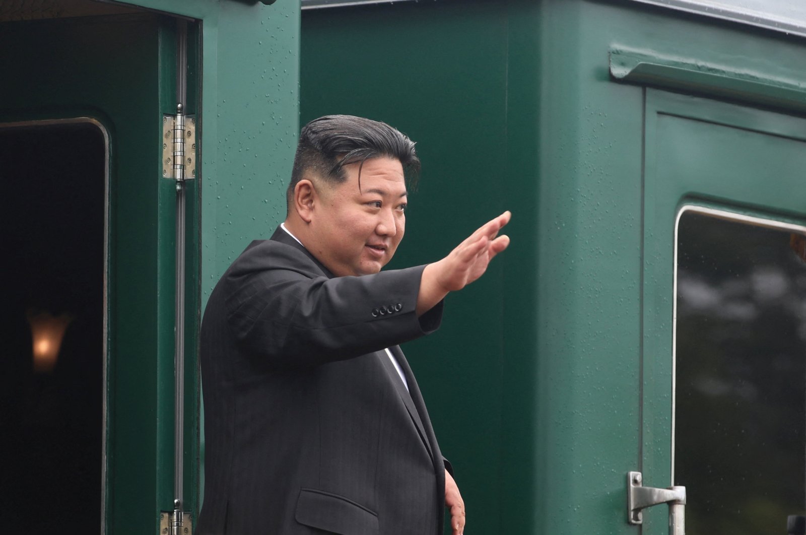 North Korean leader Kim Jong Un waves as he boards his train at a railway station in Artyom outside Vladivostok, Russia, Sept. 17, 2023. (Reuters Photo)