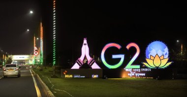 Traffics moves past an illuminated G-20 logo near the airport ahead of the summit of the Group of 20 nations in New Delhi, India, Sept. 6, 2023. (AP Photo)