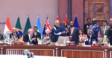Indian Prime Minister Narendra Modi (C-L) embracing President of the Union of Comoros and Chairperson of the African Union (AU), Azali Assoumani, (C-R) during the G-20 Summit at ITPO Convention Centre Pragati Maidan in New Delhi, India, Sept. 9, 2023. (EPA Photo)