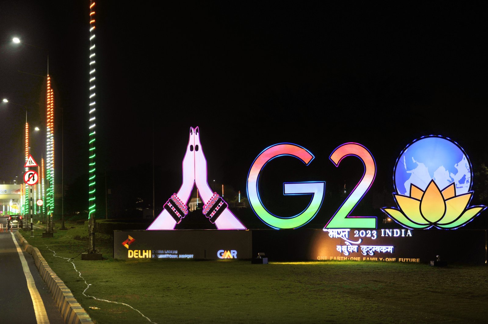 Traffics moves past an illuminated G-20 logo near the airport ahead of the summit of the Group of 20 nations in New Delhi, India, Sept. 6, 2023. (AP Photo)