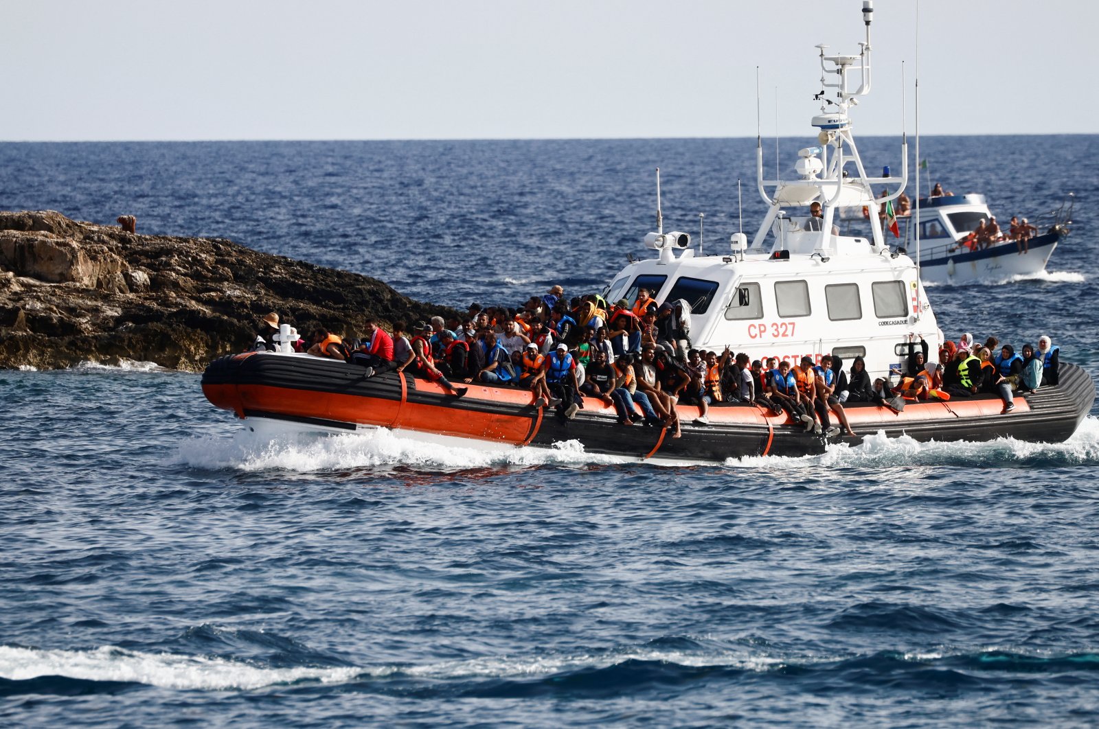 Migrants arrive on an Italian Coast Guard vessel after being rescued at sea, near the Sicilian island of Lampedusa, Italy, Sept. 18, 2023. (Reuters Photo)