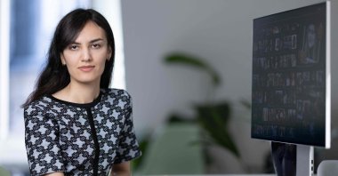 Franco-Iranian chess player Mitra Hejazipour watches Iranian news at home, Paris, France, Sept. 15, 2023. (AFP Photo)