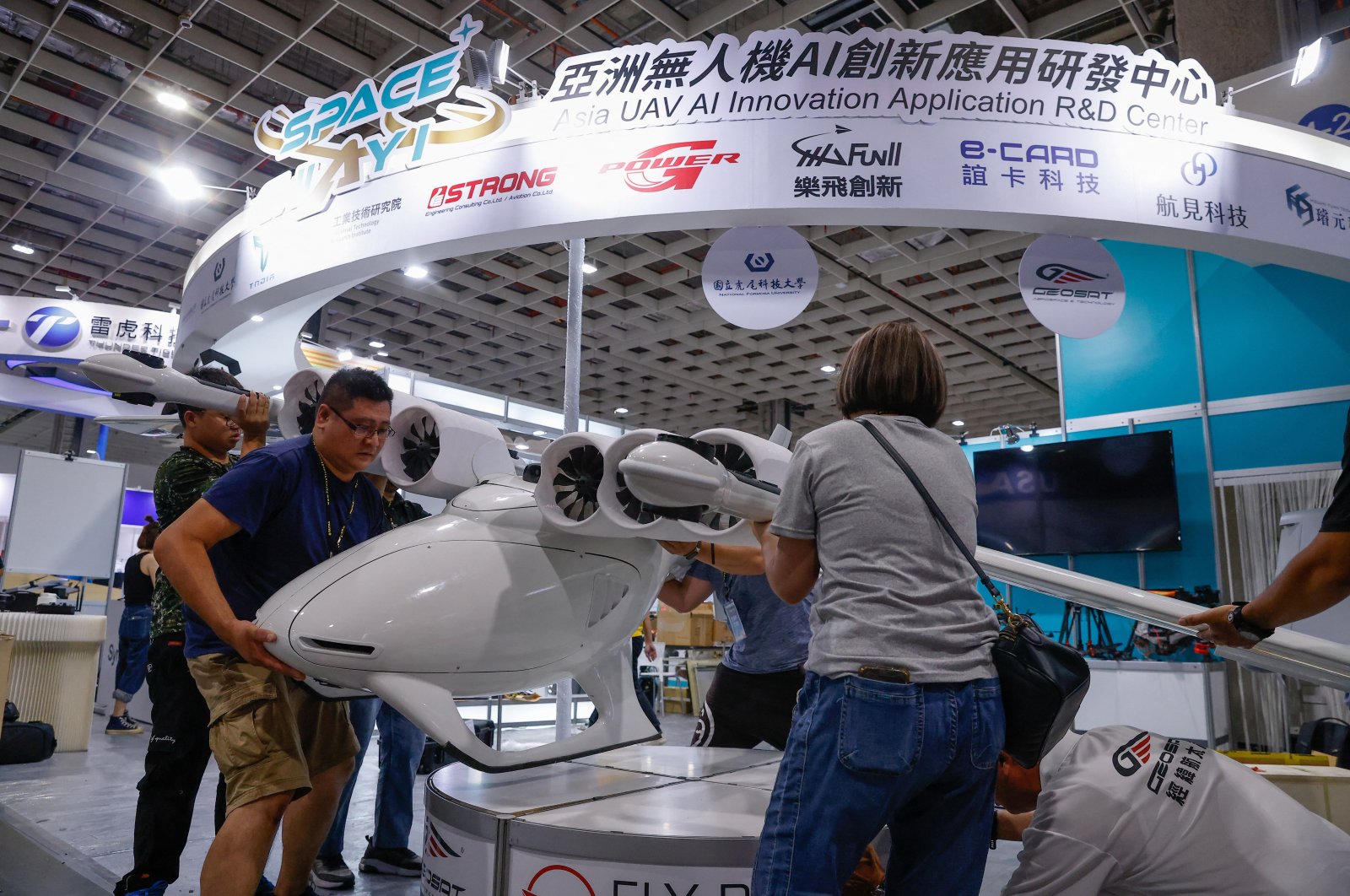Staff members put a Jackal drone on display before the opening of the 2023 Taipei Aerospace and Defense Technology Exhibition at the Nangang Exhibition Center in Taipei, Taiwan, Sept. 13, 2023. (Reuters Photo)