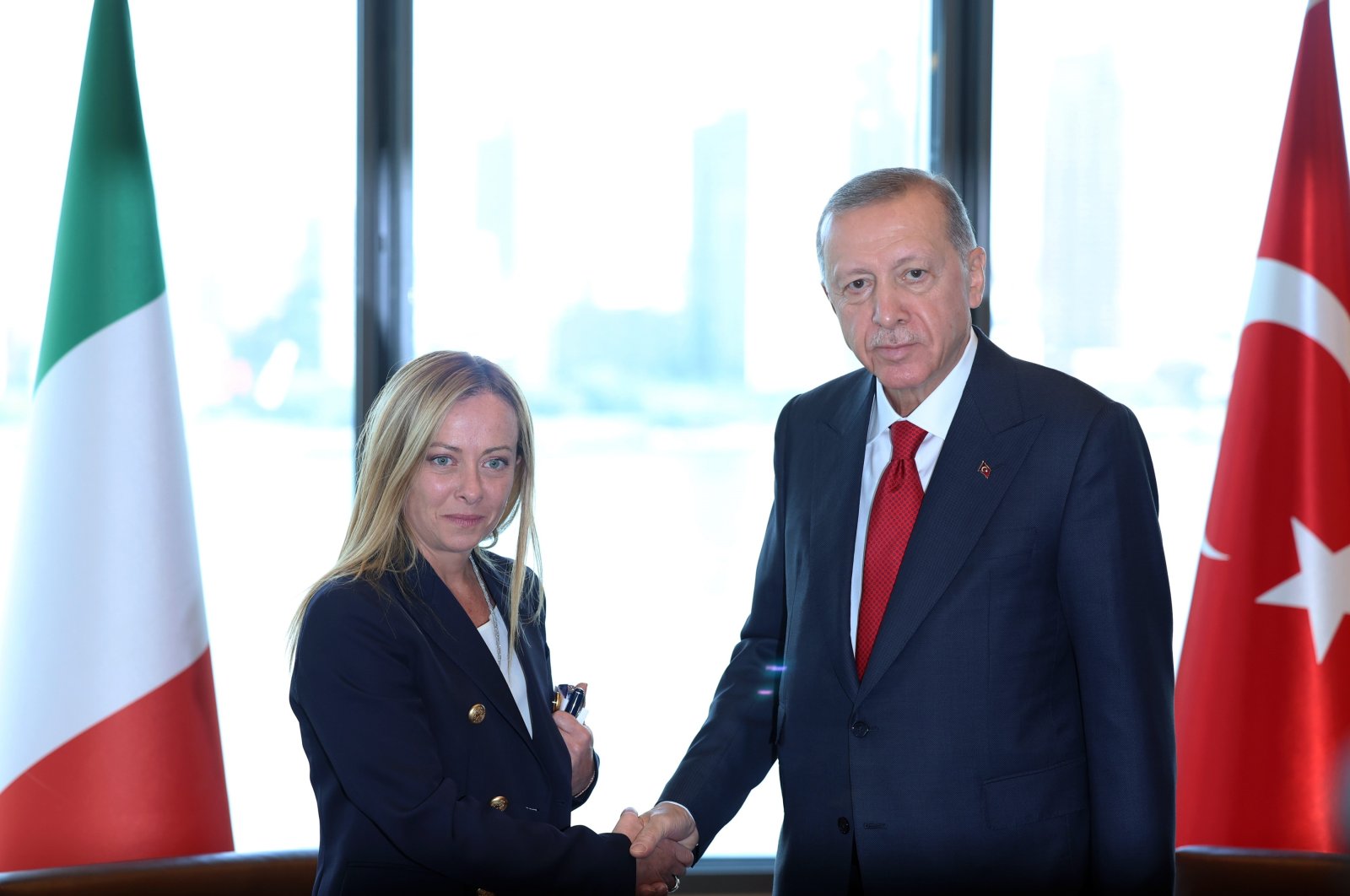 President Recep Tayyip Erdoğan and Italian PM Giorgia Meloni shake hands at the Turkish House in New York, Sept. 19, 2023. (IHA Photo)