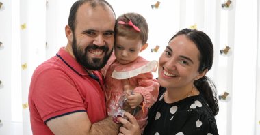 Kosovon Forta is seen with her parents after her abdominal surgeries at the Aegean University Children's Hospital, Izmir, Türkiye, Sept. 20, 2023. (AA Photo)