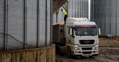 A truck loaded with corn at a grain storage facility in the village of Bilohiria, Khmelnytskyi region, Ukraine, April 19, 2023. (Reuters Photo)