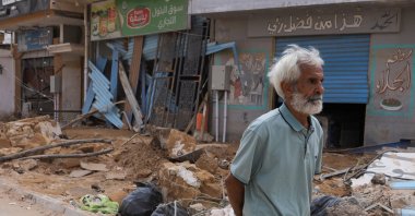 A man walks past rubble and destroyed buildings in flood-hit Derna, Libya, Sept. 19, 2023. (Reuters Photo)