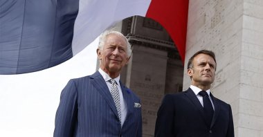 French President Emmanuel Macron (R) and Britain&#039;s King Charles III (L) depart the Arc de Triomphe after an official welcoming ceremony in Paris, France, Sept. 20, 2023. (AFP Photo)