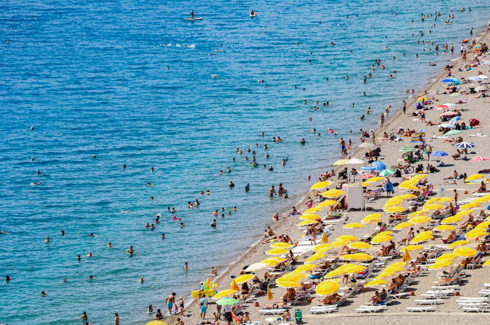 People are seen on a beach in Antalya, southern Türkiye, Sept. 19, 2023. (IHA Photo)