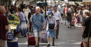 People shop at a street market in Istanbul, Türkiye, Sept. 4, 2023. (EPA Photo)
