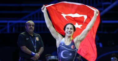 Buse Tosun Çavuşoğlu of Türkiye celebrates after becoming a world wrestling champion in the women's 68kg category at the 2023 World Wrestling Championships, in Belgrade, Serbia, Sept. 21, 2023. (AA Photo)