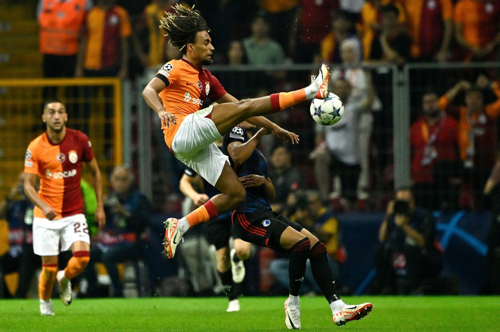 Galatasaray&#039;s Sacha Boey jumps to kick the ball during the UEFA Champions League Group A between Galatasaray and FC Copenhagen at the Rams Park stadium, Istanbul, Türkiye, Sept. 20, 2023. (AFP Photo)