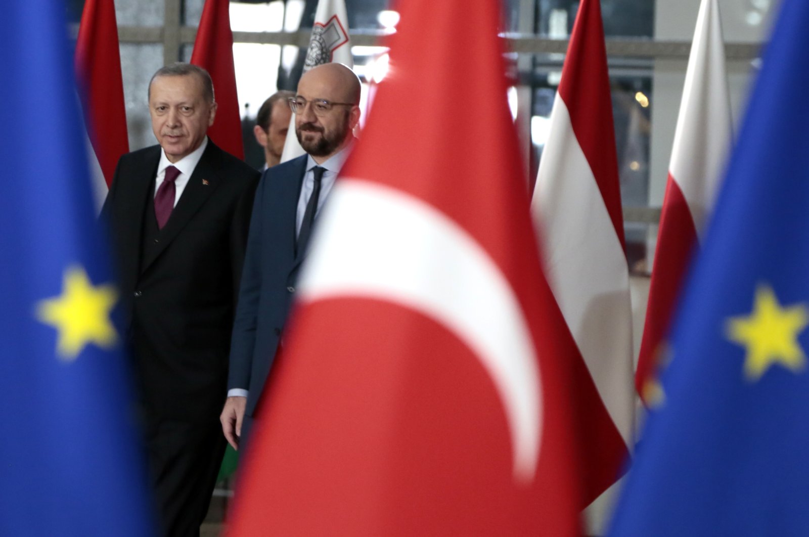 President Recep Tayyip Erdoğan walks with European Council President Charles Michel (R) prior to a meeting at the European Council building in Brussels, Belgium, March 9, 2020. (AP Photo)