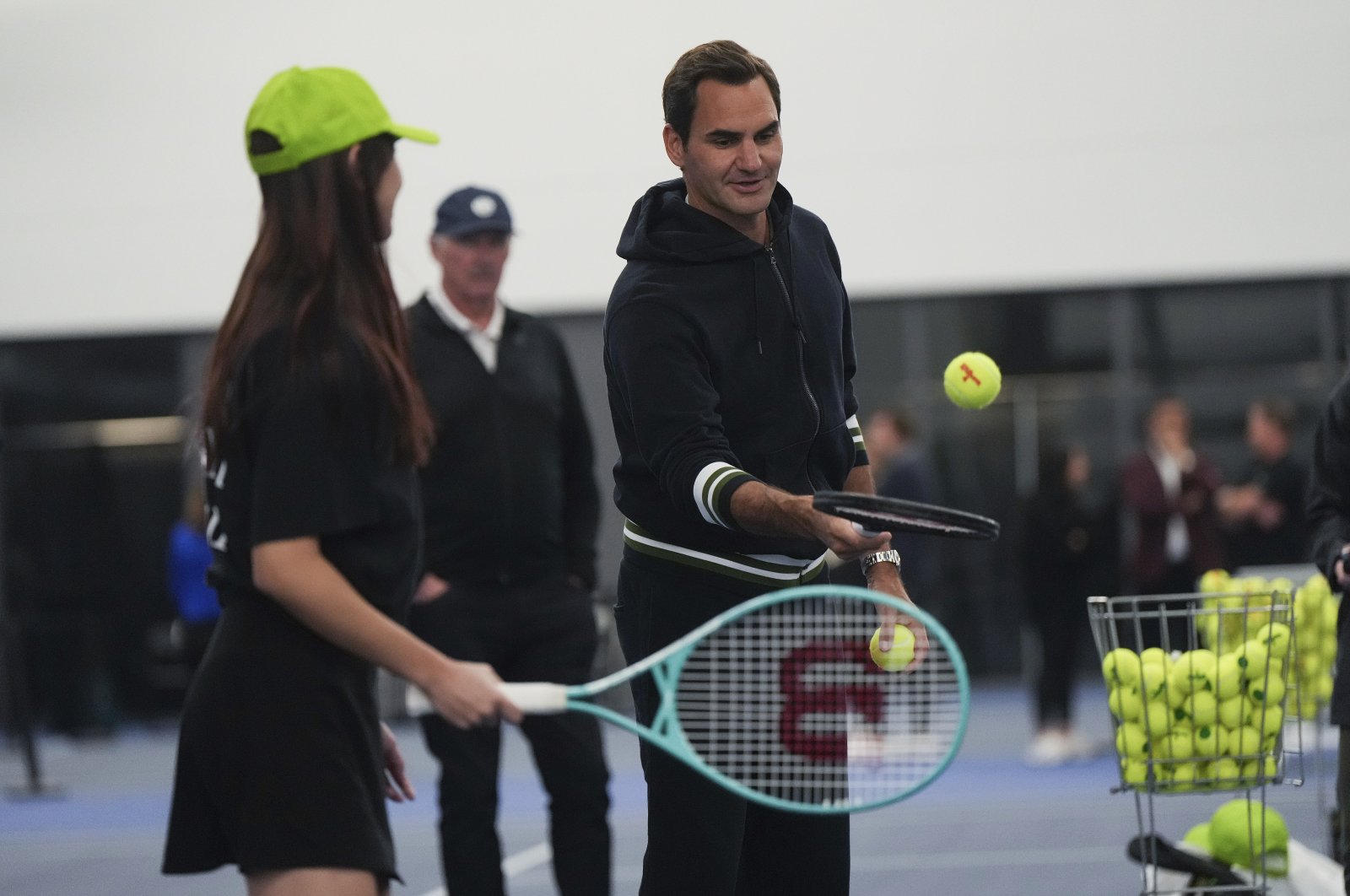 Retired tennis player Roger Federer participates in a tennis clinic for kids from the Vancouver chapters of Big Brothers and Big Sisters, as part of a partnership with Mercedes-Benz Canada, Vancouver, Canada, Sept. 19, 2023. (AP Photo)