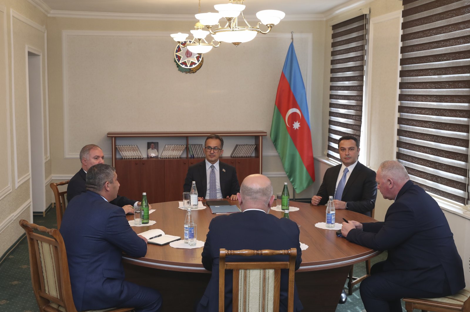Davit Melkumyan (C, back to camera), Areg Avagyan (L, front) and deputies of the National Assembly of the Nagorno-Karabakh, during talks with Azerbaijani officials headed by Ramin Mamedov (C, rear),  in Yevlakh, Azerbaijan, Sept. 21, 2023. (EPA Photo)