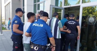 Police officers escort suspects detained over ties to Daesh terrorist group, in northwestern Tekirdağ province, Türkiye, Sept. 22, 2023. (IHA Photo)