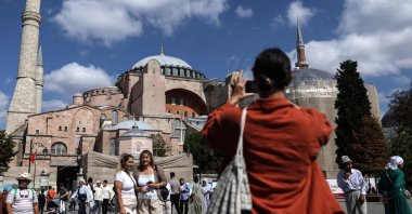 Tourists click pictures in front of the Hagia Sophia Grand Mosque in Istanbul, Türkiye, Sept. 16, 2023. (EPA Photo)