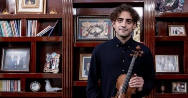 Solo concert violinist Elvin Hoxha Ganiyev poses during an interview with Anadolu Agency (AA). (AA Photo)