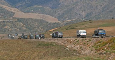 Vehicles of Russian peacekeepers leaving Azerbaijan's Karabakh region for Armenia pass an Armenian checkpoint on a road near the village of Kornidzor, Armenia Sept. 22, 2023. (Reuters Photo)