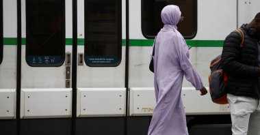 A Muslim woman, wearing the style of dress called an abaya, walks in a street in Nantes, France, Aug. 29, 2023. (Reuters File Photo)