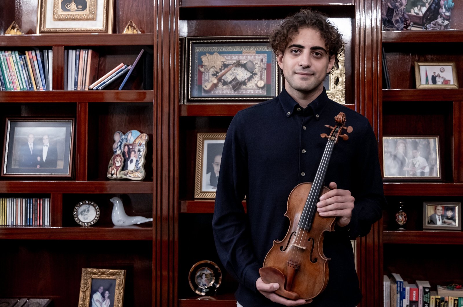 Solo concert violinist Elvin Hoxha Ganiyev poses during an interview with Anadolu Agency (AA). (AA Photo)