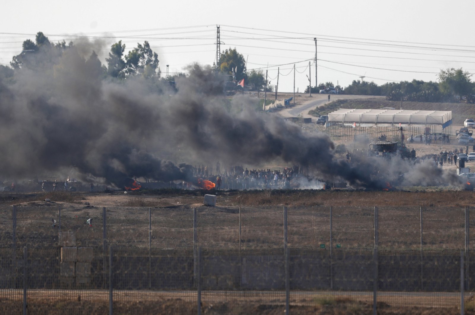 Palestinian protesters gather during clashes with the Israeli troops on the border with Gaza Strip, Sept. 22, 2023. (EPA Photo)