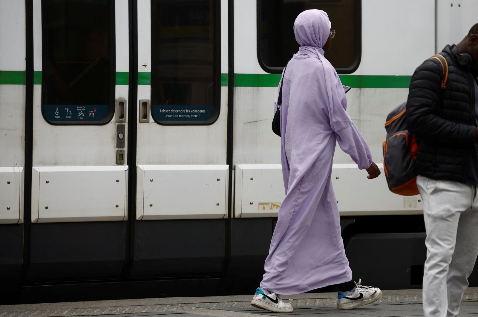 A Muslim woman, wearing the style of dress called an abaya, walks in a street in Nantes, France, Aug. 29, 2023. (Reuters File Photo)
