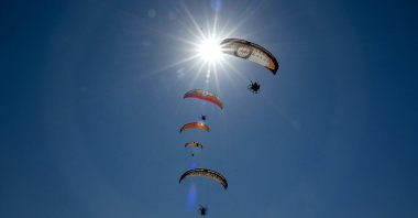 Paragliding enthusiasts are photographed beneath the sunny sky of eastern Türkiye's Van, Sept. 24, 2023. (AA Photo)